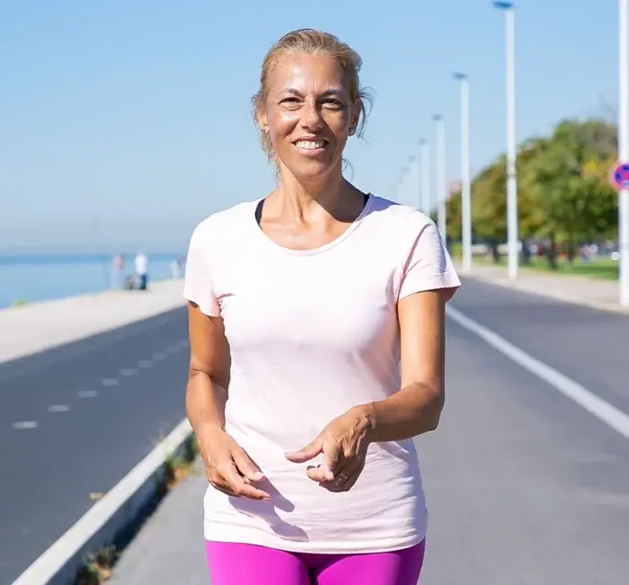 Smiling woman walking outdoors